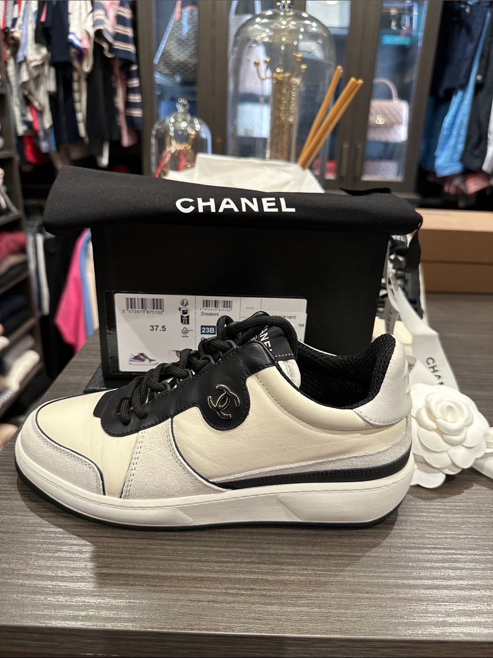 CHANEL ivory/white/black Low Top Sneakers in leather and suede.
